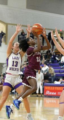 Littlefield’s Amoni Jefferson gets to the basket for a lay-up, during the first half of the Lady Cats’ Bi-district loss to Dalhart in Canyon on Monday. (Staff Photo by Derek Lopez)