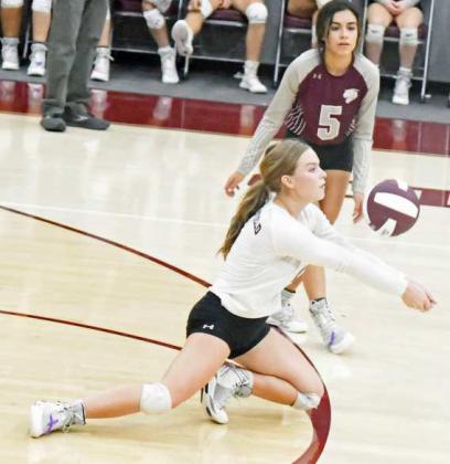 KEEPING THE BALL IN PLAY – Littlefield libero Kennadi Hanlin, digs out a hit from Tulia, during the first set of their, 3-2, victory over the Lady Hornets on Tuesday at Wildcat Gym. (Staff Photo by Derek Lopez)