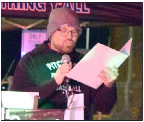 Pastor Tanner Wison of First Baptist Church read the Christmas Story at the Holiday on the Square event in Littlefield on Thursday, Dec 16, 2021. (Photo by Ann Reagan)