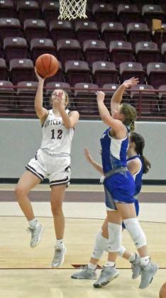 GETTING TO THE BASKET – Littlefield junior, Madison McNeese (12), gets to the rim for a lay-up, during the first half of the Lady Cats’ victory over Olton in their Wildcat Classic Tournament-opener on Monday night. (Staff Photo by Derek Lopez)