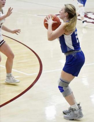 KNOCKING DOWN THE THREE – Olton senior, Shaylee Leathers (22), drains a three from the left wing, during the second half of the Fillies loss to Littlefield in their tournament-opener on Monday night at the Wildcat Classic. (Staff Photo by Derek Lopez)