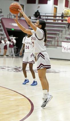 Littlefield freshman, Madison Williams, puts up a three from the left elbow, during the Lady Cats’ district contest with Friona on Friday at Wildcat Gym. (StaffPhoto by Derek Lopez)