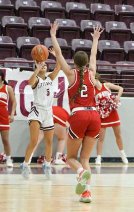 Littlefield senior, Bri Martinez, fires up a three from the right elbow, during the Lady Cats’ district contest with Friona on Friday at Wildcat Gym. (StaffPhoto by Derek Lopez)