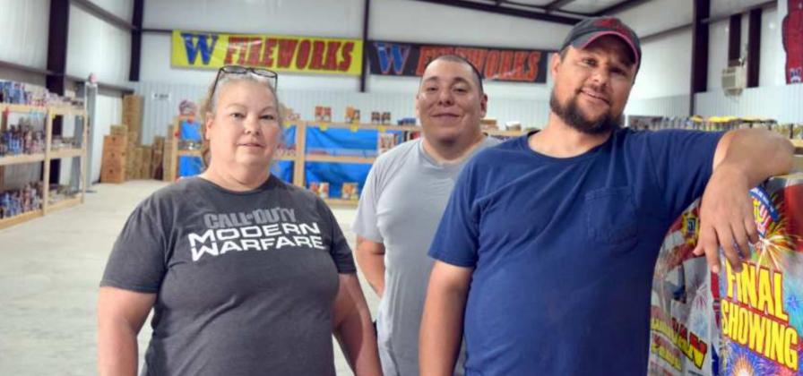 MR. W FIREWORKS -- Pamela Demeter, Jake Cavazos, John Demeter, operators for the company is located on HWY 385 south from Littlefield. (Photo by Ann Reagan)