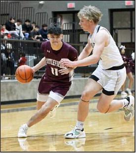 Littlefield junior, Jose Payan, looks to drive past a Muleshoe defender, during the first half of the Wildcats’ trouncing of Muleshoe on Friday on the road. (Staff Photo by Derek Lopez)