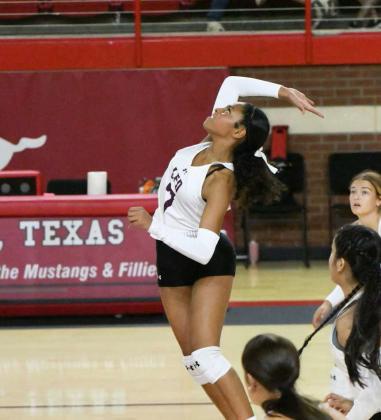 Littlefield’s London Taylor goes up to deliver a kill, during the second set of their Denver City Tournamentopener against Snyder on Thursday. (Staff Photo by Derek Lopez)