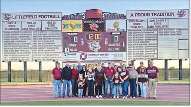 Legendary Littlefield Coach Lewis Boomer was honored with a plaque prior to last Friday’s War on 84 with Muleshoe. Coach Boomer was surrounded by family and friends to accept the honor. (Staff Photo by Derek Lopez)