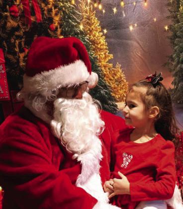 Leticia Arce, Santa Clause, and Virginia Arce along with Elena Alvarado ( not pictured) held their Christmas Fundraiser benefiting the Make-a-Wish foundation at Nopalitos Restaurant in Littlefield Texas on Saturday, December 13, 2025. Donors would receive a burrito, doughnut,drink, and button picture with Santa for a $9.99 donation. (Photo by Ann Reagan)