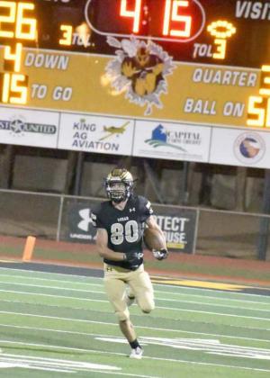GOOD FIELD POSITION – Sudan senior punt returner, Lane Wilson, gets an open seam on the left side, as he sprints down the sideline, setting the Hornets up with great field position near midfield after the punt return, during Sudan’s 46-14, Homecoming victory on Friday at Hornet Stadium. (Photo by Derek Lopez)