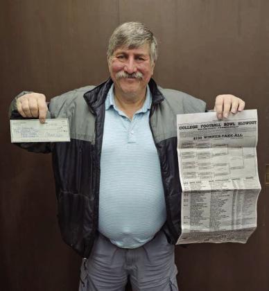Ed Dabrowski and Juan Garza (not pictured), split the first place winnings for this year’s Bowl Pick-Em contest. (Staff Photo by Derek Lopez)