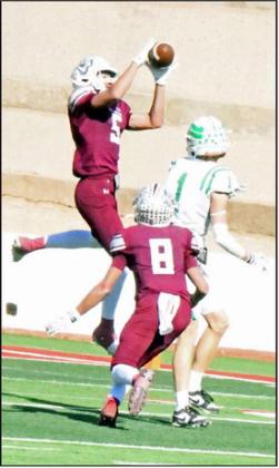 Littlefiled safety, Nate Castaneda (5), picks off Wall’s Landon York, during the first half of the Wildcat’s, 56-21, loss to the Hawks in Sweetwater in the Class 3A Regional Play-off game. (Staff Photo by Derek Lopez)