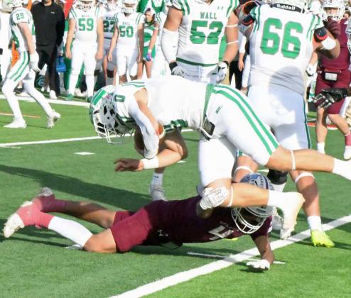 Littlefiled senior linebacker, Caden Reyes (4), makes a tackle near the line of scrimmage, during the fourth quarter of the Wildcat’s, 5621, loss to the Hawks in Sweetwater in the Class 3A Regional Playoff game. (Staff Photo by Derek Lopez)