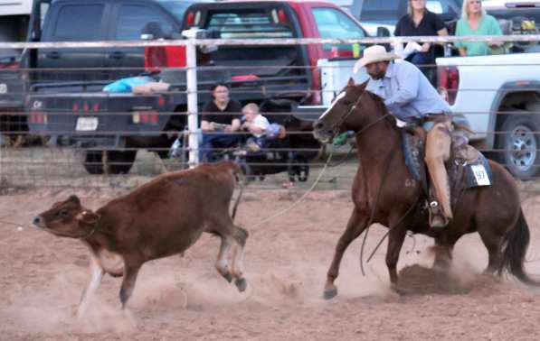 This competitor successfully throws his loop during the Branding Competition at the WRCA Rodeo. (Photo by Ann Reagan)