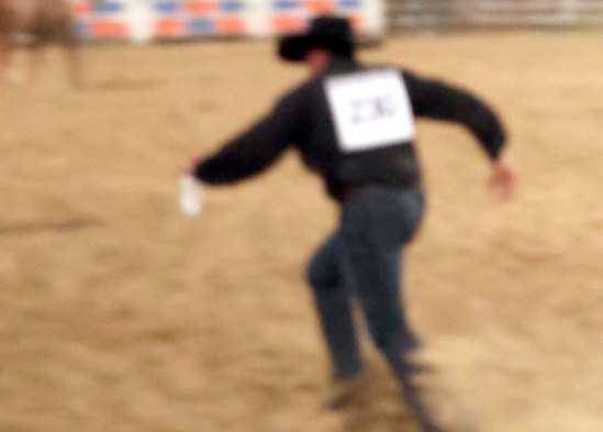The race is on to deliver the milk to the finish line in the Wild Cow Milking competition during the WRCA Rodeo held Friday, Sept. 19. (Photo by Ann Reagan)