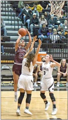 PULLING UP— Littlefield senior, Geyah Garza (23), pulls up for a jumper from the right wing over the Muleshoe defense, during the second half of the Lady Cats’ come from behind victory over Muleshoe on Friday, 34-31. (Staff Photo by Derek Lopez)