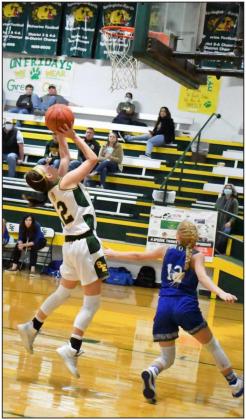UP FOR TWO— Springlake-Earth senior, Carsann Baker (12), drops in a lay-up in transition, during the second half of the Lady Wolverines home win over the Olton Fillies last week at Wolverine Gym. (Staff Photo by Derek Lopez)