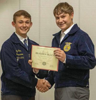 FFA Vice President Ty Carr presents Brayden Black with a Greenhand FFA Degree at the annual FFA banquet on May 12, 2025. (Staff Photo by Madison Vidales)