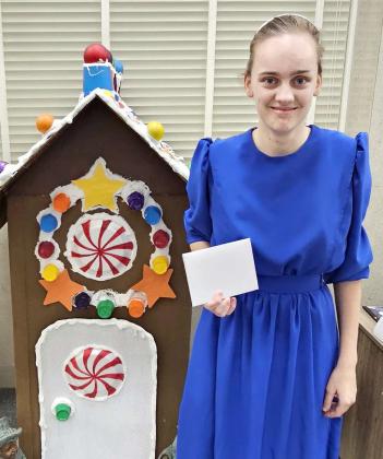 Abigail Tucheck got third place in the 13 to 17-year old division of the Lamb County Library’s Gingerbread House Decorating contest. (Staff Photo by Derek Lopez)