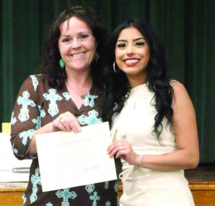 Lamb County NRCS District Conservationist Brenda May awards Springlake-Earth High School’s 2026 first-place senior scholarship winner, Aabriella Villanueva, with a certificate and a $ 1,000 scholarship. (Submitted Photo)