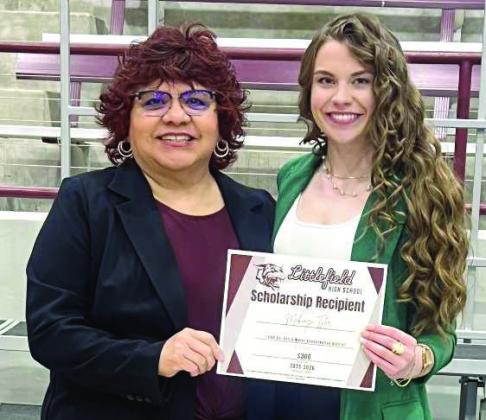 Lamb County SWCD District Clerk Arcie Rodriguez awards Littlefield High School’s 2026 third-place senior scholarship winner, Makinzi Tyler, with a certificate and a $300 scholarship. (Submitted Photo)