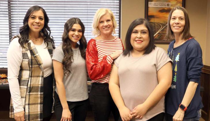 left to right- Juanita Sierra, Paige Hood, Shanda Broadhurst, Monica Gonzalez, and Robin Rucker served the buffet during the First United Bank Christmas Open House on Friday December 13, 2024. (Photo by Ann Reagan)