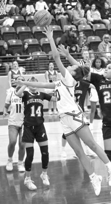 Littlefield freshman, Zalise Davis, beats the defense to the rim for a lay-up, during the first half of the Lady Cats’ victory over Muleshoe Tuesday night at Wildcat Gym. (Staff Photo by Derek Lopez)