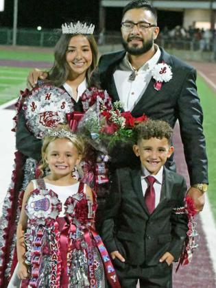 Littlefield senior, Iris Hernandez, was crowned the 2025 Littlefield Homecoming Queen on Friday, during halftime of the Wildcats’ victory over Coahoma. Shown: Iris and her dad, Josh Hernandez, along with flower girl, Makay McNeese and crown bearer, Stetson Zapata. (Staff Photo by Derek Lopez)