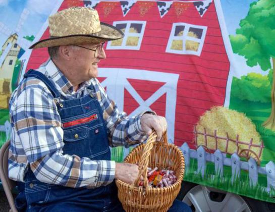 Dressed up as a farmer, Jim Harris passed out candy to the Crescent Park Church of Christ’s Trunk or Treat attendees on Oct. 27, 2024. (Staff Photo by Madison Vidales)