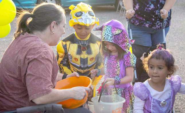 Children line up to receive candy at the Crescent Park Church of Christ’s Trunk or Treat on Oct. 27, 2024. (Staff Photo by Madison Vidales)