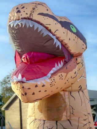 A child dressed in an inflatable dinosaur costume attends the Crescent Park Church of Christ’s Trunk or Treat on Oct. 27, 2024. (Staff Photo by Madison Vidales)
