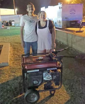 The OCCA Raffle winner for the Generator was Christella Rivera, pictured with Adrian Reyna. (Photo by Wesley Quigley)
