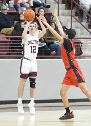 Littlfield junior guard, Chip Green (12), drains a three from the right side, during the first half of the Wildcats’, 77-65, victory over the Cubs at Wildcat Gym on Tuesday. (Staff Photo by Derek Lopez)