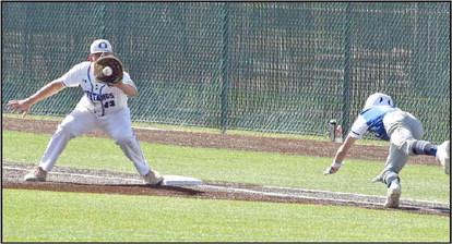 Olton first baseman Brennon Huguley caught the ball for an out against Smyer's Skyler Pond in the UIL High School Baseball Bi-District Championship in Littlefield last Friday. The Mustangs swept the best of three series 11-10 and 6-4, to claim the first play-off series win in Olton baseball program history. (Photo by Jay Kelley)