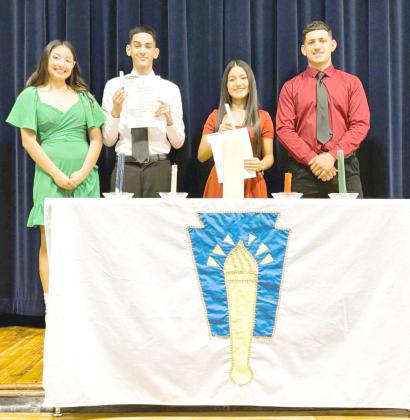 Amherst I.S.D. members of the National Honor Society were inducted into the Horace Mann Chapter of the National Honor Society during a special ceremony Monday afternoon, December 16, 2024, in the Amherst School Auditorium. New members in the center, holding a candle and a certificate, are Cesar Gaytan Morales and Deserie Rodriguez. Existing members are America Pacheco (far left) and Kevin Garcia Torres (far right). (Submitted Photo)