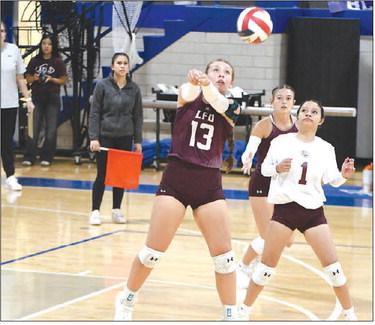 Littlefield's Maggie McNeese sends a hit over the net, during the first set of the Lady Cat's road victory in Olton last Tuesday over the Fillies in four sets. (Staff Photo by Derek Lopez)