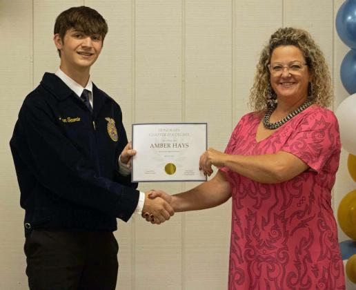 Ky Hays presents Amber Hays with the Honorary Chapter FFA Degree at the annual FFA banquet on May 12, 2025. (Staff Photo by Madison Vidales)
