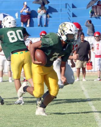 The Springlake-Earth ball carrier looks to get into the open field for a big gain, during their first scrimmage of the season at Amherst. (Photo Courtesy of Sarah Weldon)
