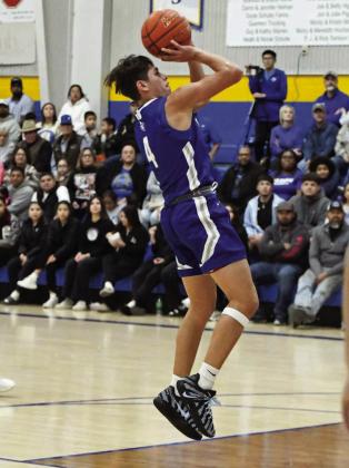 Olton’s Matias Flores pulls up for a jumper from the right elbow, during the second quarter of the Mustangs’, 61-46, victory over Herford in the Nazareth Invitational Semi-Finals. (Staff Photo by Derek Lopez)