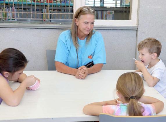 This family is enjoying ice cream sundaes at the Ice Cream Social event at the Lamb County Library on Saturday, April 13, 2024. (Photo by Ann Reagan)