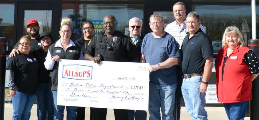 DONATION TO SUDAN’S POLICE DEPARTMENT— This check for $1,250 was donated to the Sudan Police Department Friday morning, during the Grand Opening of the new Allsup’s Market in Sudan. The donation was presented by Yesway and Allsup’s. Holding the check are Store manager Sherri Bear, Police Chief Everest Williams, and Sudan Mayor Pro Tem Sam Merryman. (Staff Photo by Joella Lovvorn)