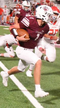 FINISHING THE GAME – Littlefield senior quarterback, Ethan Garcia, takes a carry around the right side, lowering his shoulder, as he gets ready to collide with the defense, staying in bounds to keep the clock running during the fourth quarter of the Wildcat’s victory over Denver City on Friday night. (Staff Photo by Derek Lopez)