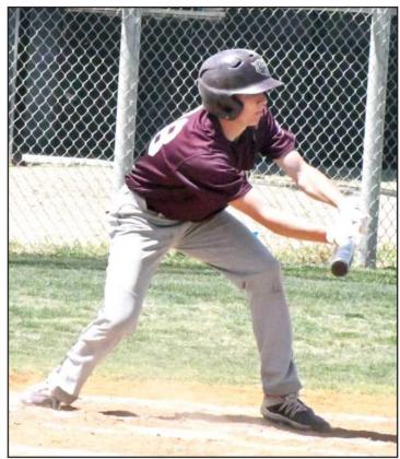 PERFECT BUNT – Littlefield’s Chip Green lays down a bunt that hugs the third-base line, but never goes foul, giving Green an infield hit in the top of the third inning of the Wildcats, 20-1, victory over Muleshoe on Saturday. (Staff Photo by Derek Lopez)