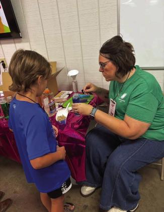 Campers at the 4-H Project Camp are shown making calming jars and learning ways to deal with stressful situations, during day one of Project Camp on Monday at the Lamb County Ag Center. (Submitted Photo)