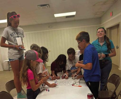 Campers at the 4-H Project Camp are shown making group flags, during day one of Project Camp on Monday at the Lamb County Ag Center. (Submitted Photo)