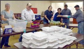 The City of Amherst once again was raising money for new park playground equipment by holding their annual Homecoming Hamburger fundraiser. Left to right- Marlene Leal, Lalo Leal, and Jennifer Sawyer are delivering the hamburger dinners served by City of Amherst Employees during the Amherst Homecoming Hamburger Fundraiser on Thursday, September 21, 2023. (Photo by Ann Reagan)