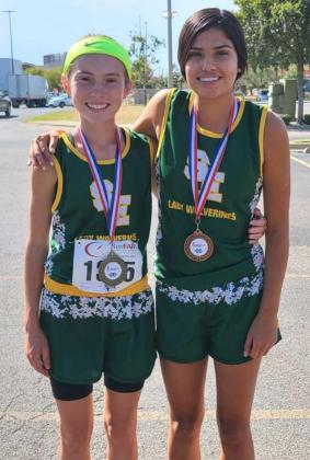 BRINGING HOME THE HARDWARE – The Springlake-Earth Lady Wolverines’ varsity cross country team competed a the Lubbock ISD Invitational on Saturday, where (Left) Taytum Goodman placed first overall, (Right) DD Delgado placed 16 th overall and Reagan Ethridge (Not Shown) places 19 th overall. (Submitted Photo)