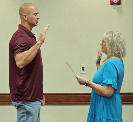 Garry Ozbirn was sworn in by Jackie Milligan on Monday, during the lunch school board meeting, as an At-large member of the Littlefield ISD School Board. (Staff Photo by Derek Lopez)
