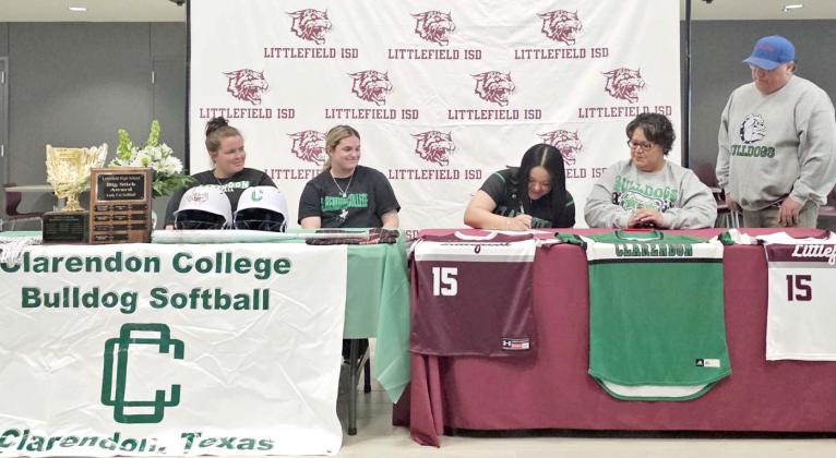 Littlefield senior softball player, Natalia Sanchez, is shown signing her letter of intent to continue her softball and academic career at Clarendon College. She is shown with her parents as well as the Clarendon Softball Coaches, during a signing ceremony on Monday, February 3, in the commons area at Littlefield High School. (Staff Photo by Derek Lopez)