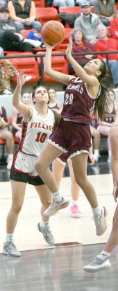 Littlefield’s Ari Castillo (20), gets to the basket for a lay-up, during the second half of the Lady Cat’s, 5444, loss to the Fillies in Shallowater on Friday. (Staff Photo by Derek Lopez)