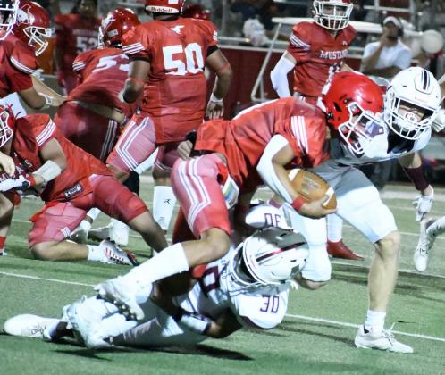 TACKLE FOR LOSS – Littlefield junior linebacker, Noah Lopez (30), makes an open- field tackle in the backfield to bring down the Denver City ball carrier for a loss in the second half of the Wildcats’, 33-14, victory over Denver City on the road on Friday night. (Staff Photo by Derek Lopez)